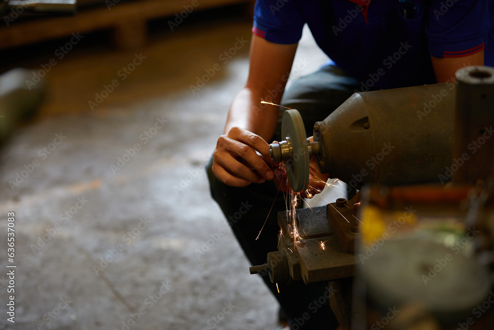 closeup worker hands drilling cnc machine in the factory closeup worker hands drilling cnc machine in the factory