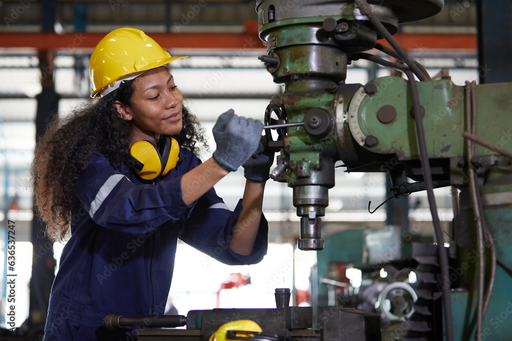 factory worker or technician checking and control lathe machine in factory factory worker or technician checking and control lathe machine in factory