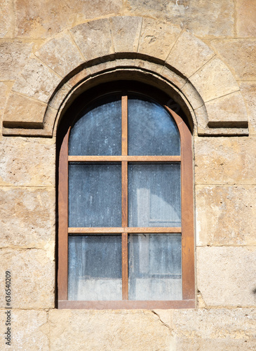 Beautiful architecture of old windows in brick houses.