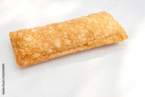 Crispy Apple Pie with selective focus on a white background.