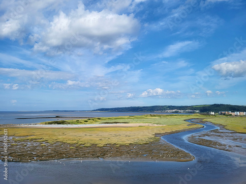 Incoming tide at North Dock - a former industrial dock exporting coal and tin plate, now reclaimed by nature.