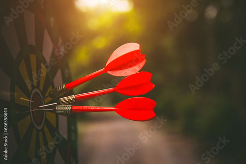 Bullseye or Bulls eye target or dartboard has dart arrow throw hitting the center of a shooting for financial business targeting planning and aim to winner goal of business concept.