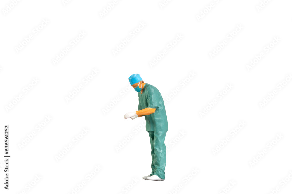 Miniature people young doctor in scrubs Isolated on white background with clipping path Miniature people young doctor in scrubs Isolated on white background with clipping path