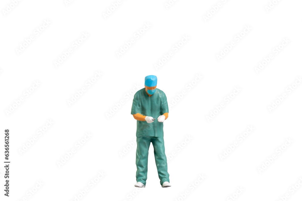 Miniature people young doctor in scrubs Isolated on white background with clipping path Miniature people young doctor in scrubs Isolated on white background with clipping path