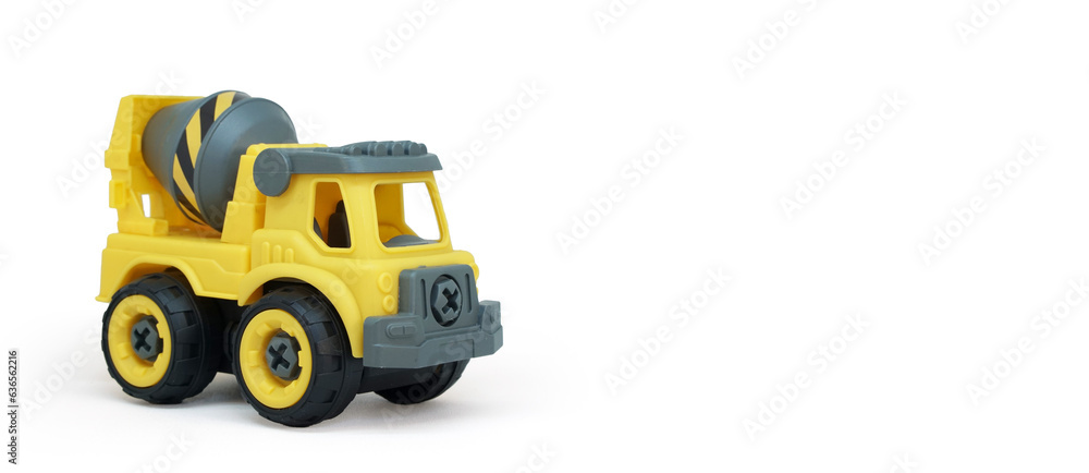 Yellow plastic concrete mixer truck toy isolated on white background. construction vechicle truck. a copy space for banner of toy store.