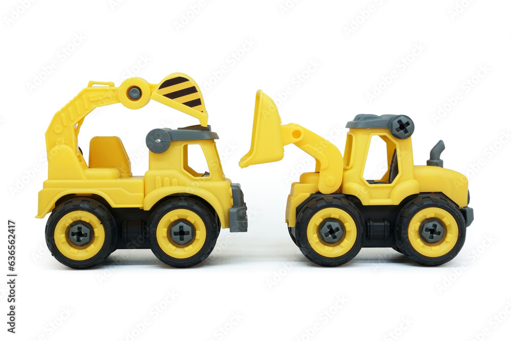 yellow plastic truck and bulldozer toy facing each other isolated on white background. heavy construction vehicle.