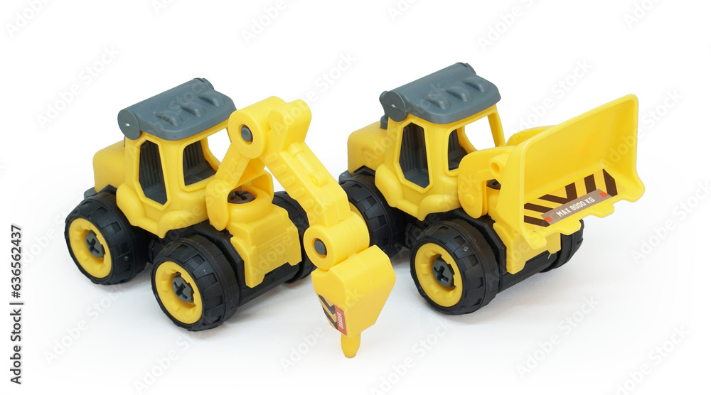 yellow plastic toy of tractor drill and bulldozer or loader isolated on white background. heavy construction vehicle. yellow plastic toy of tractor drill and bulldozer or loader isolated on white background. heavy construction vehicle.