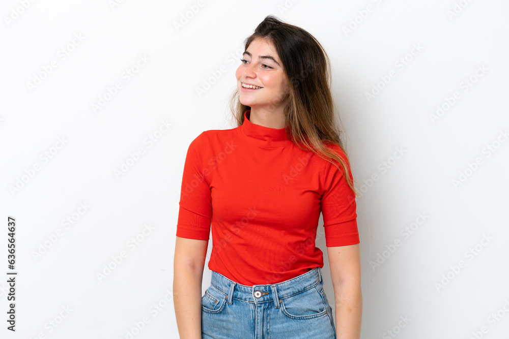 Fototapeta premium Young caucasian woman isolated on white background looking to the side and smiling