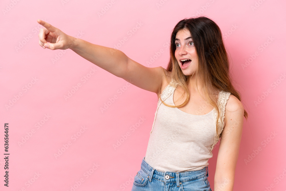 Young caucasian woman isolated on pink background pointing away Young caucasian woman isolated on pink background pointing away