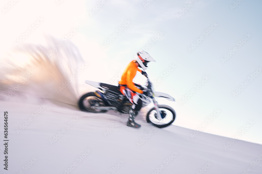 Fototapeta premium Bike, dust and motion blur with a sports man riding a vehicle in the desert for adventure or adrenaline. Motorcycle, training and speed with an athlete on sand in nature for speed, freedom or energy