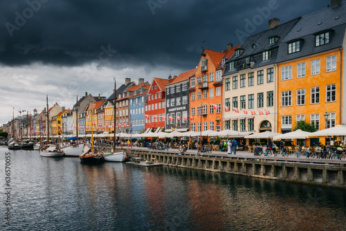 Nyhavn in Copenhagen on a summer afternoon. The colorful facades of the houses create an amazing atmosphere.