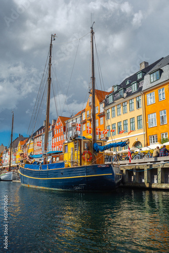 Nyhavn in Copenhagen on a summer afternoon. The colorful facades of the houses create an amazing atmosphere.