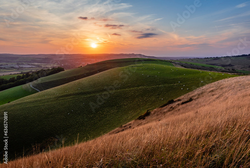 August sunset from mount Caburn over the Lewes downs east Sussex south east England UK