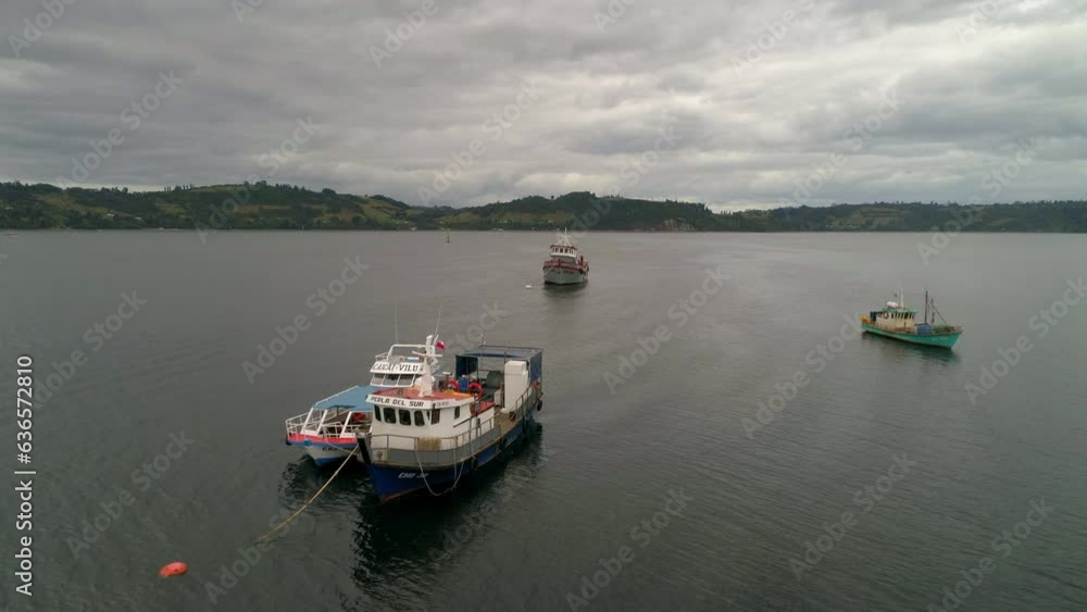 Aerial Shot Of Boats Sailing In Lake Against Cloudy Sky, Drone Flying Forward Over Water - Castro, Chile Aerial Shot Of Boats Sailing In Lake Against Cloudy Sky, Drone Flying Forward Over Water - Castro, Chile