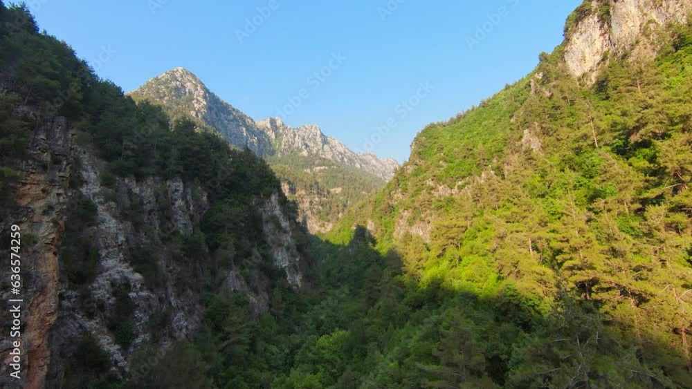 Aerial flying over mountains of Abraham River valley on sunny day with blue skies Aerial flying over mountains of Abraham River valley on sunny day with blue skies
