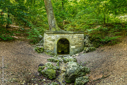 Old roman fountain in a forest of Weissenburg, Franconia