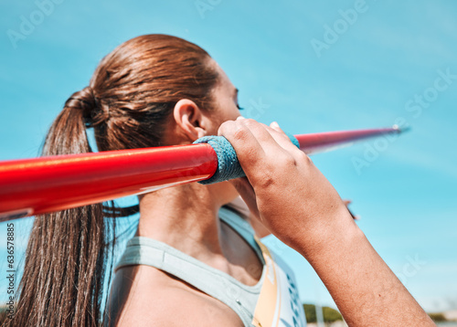 Woman, javelin and olympic athlete in sports competition, practice or training in fitness on stadium field. Active female person or athletic competitor throwing spear, poll or stick in distance