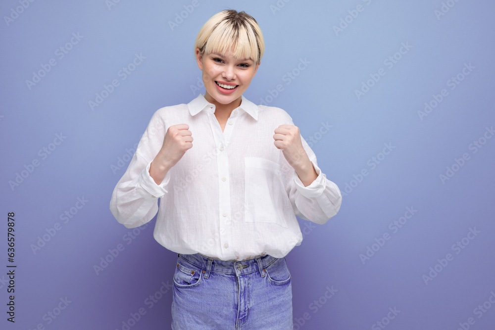 young emotional pretty blond secretary woman dressed in a white shirt on a purple background with copy space young emotional pretty blond secretary woman dressed in a white shirt on a purple background with copy space