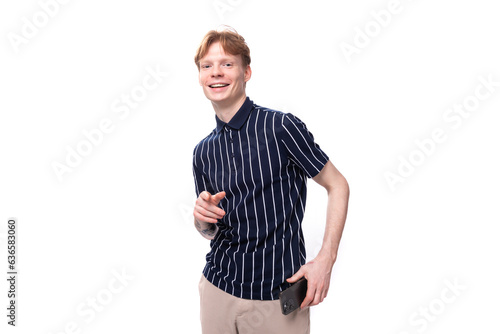 young European blond guy in a striped polo shirt on a white background