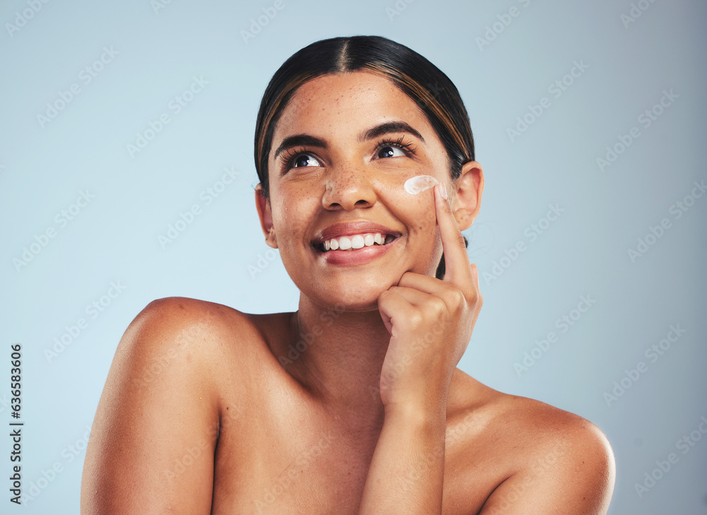 Face, cosmetics cream and portrait of woman with aesthetic shine, dermatology and skincare makeup on studio background. Happy model thinking of facial sunscreen lotion for self care, beauty and glow
