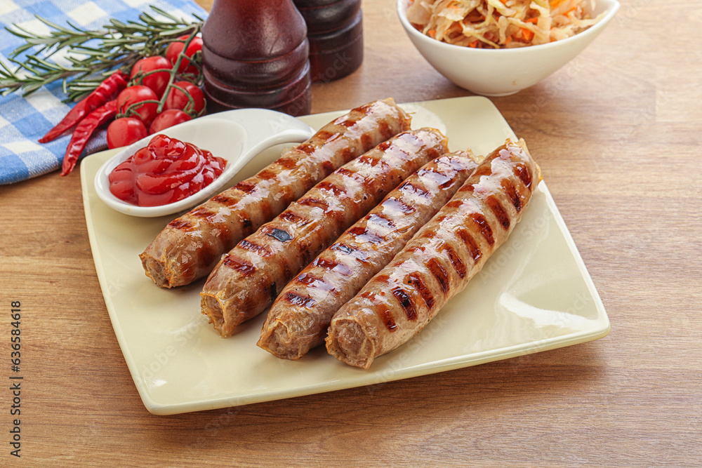 Grilled sausages with cabbage and sauce