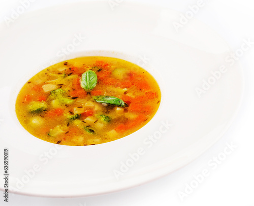 Plate of chicken soup isolated on white