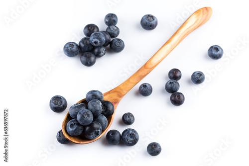 Fresh blueberries in wooden spoon