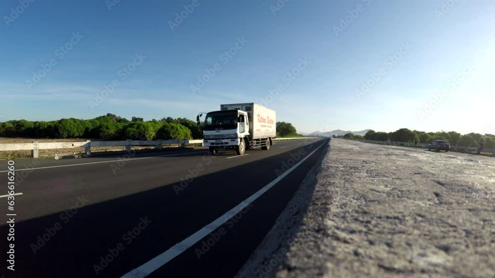 Cars passing on an inter province Freeway lane toll highway Cars passing on an inter province Freeway lane toll highway