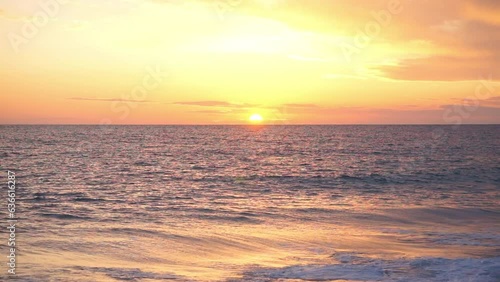 Sunset over sea horizon and clouds, hand held