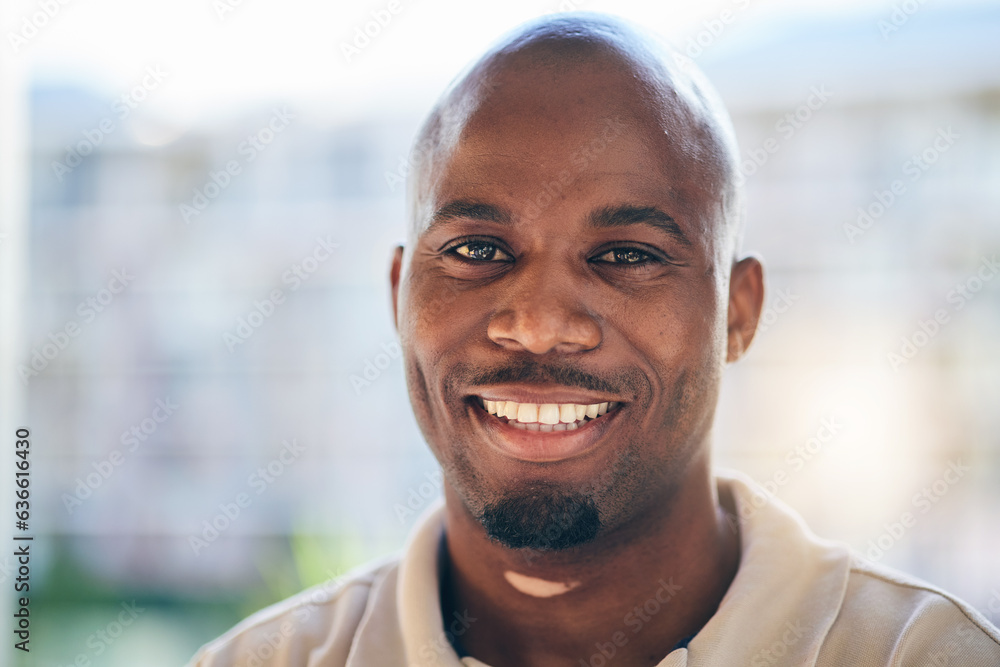 Smile, happy and portrait of a businessman in the office with confidence and positive attitude. Young, career and face headshot of professional African male designer standing in a modern workplace. Smile, happy and portrait of a businessman in the office with confidence and positive attitude. Young, career and face headshot of professional African male designer standing in a modern workplace.