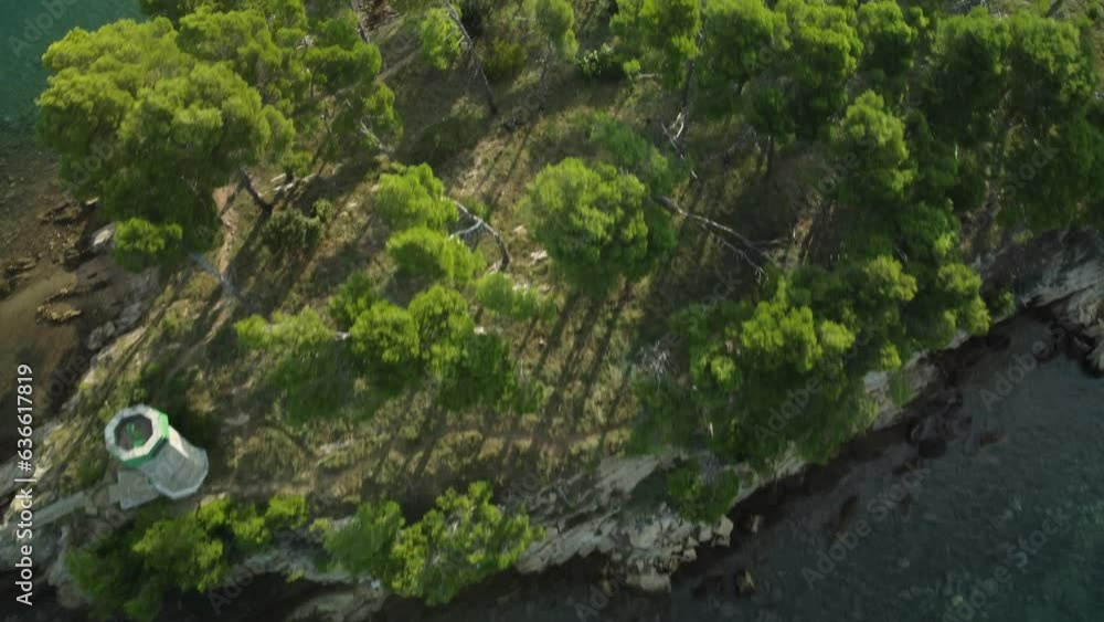 small uninhabited island in the Adriatic Sea, shot by drone, summer, clear sky, early morning, lighthouse small uninhabited island in the Adriatic Sea, shot by drone, summer, clear sky, early morning, lighthouse
