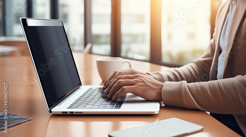 Young Man Using Laptop with Blank Empty Mockup Screen