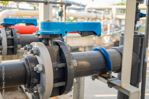 Butterfly manual Valve on the waste water pipe line. The photo is suitable to use for industry background photography, power plant poster and electricity content media.