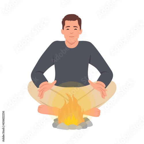 Person put on fire his hands for having heat from fire to warm up his body and warm surroundings. Man and sitting by bonfire putting logs and getting warmth. Camping and traveling.