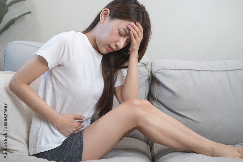 person feeling stomach pain menstruation on the bed. person feeling stomach pain menstruation on the bed.