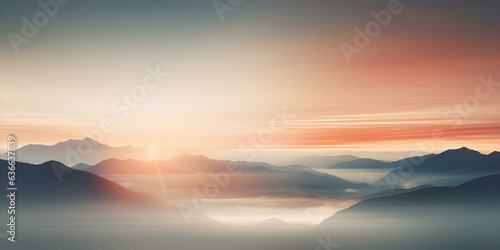 A blurry image, a banner, the sun rising over the mountains in the style of a bokeh panorama. © Vadim
