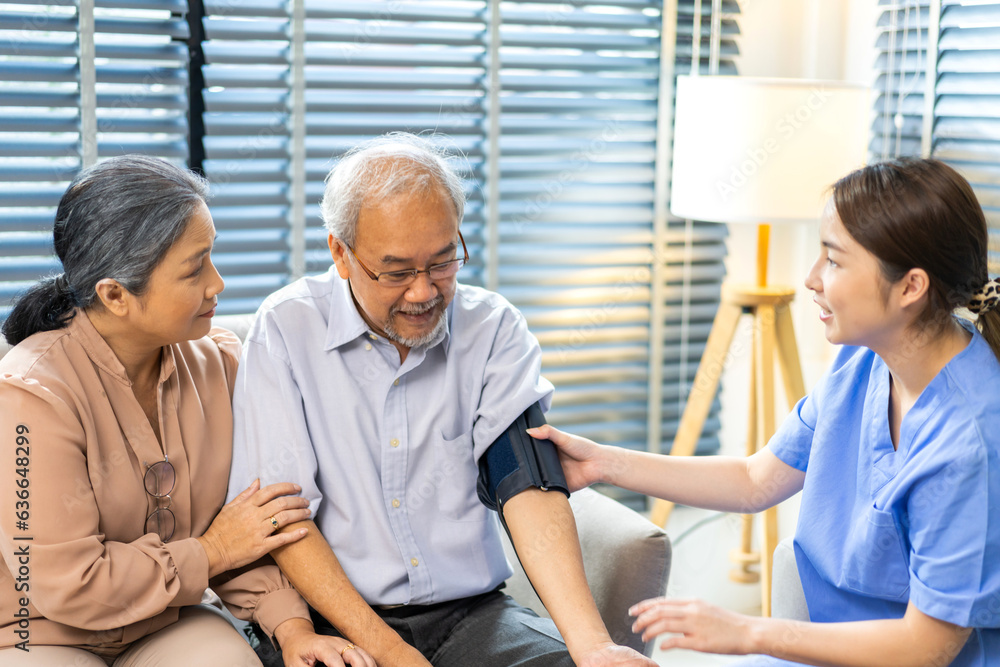 Obraz premium Portrait of smiling caring asian nurse service help support discussing and consulting taking care with senior elderly asian man and woman couple at home visit.senior retirement home care concept