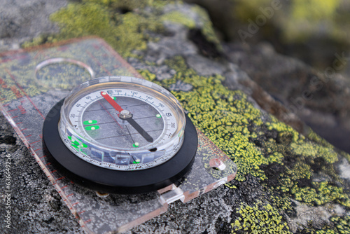 Compass on rock. Orientation Concept. Analogical Compass Abandoned on the Rocks.
