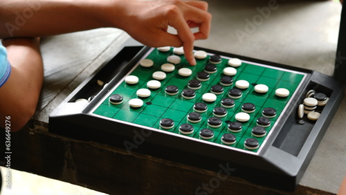 Reversi is a strategy board game for two players, played on an 8×8 uncheckered board. It was invented in 1883. Othello, a variant with a fixed initial setup of the board, was patented in 1971.