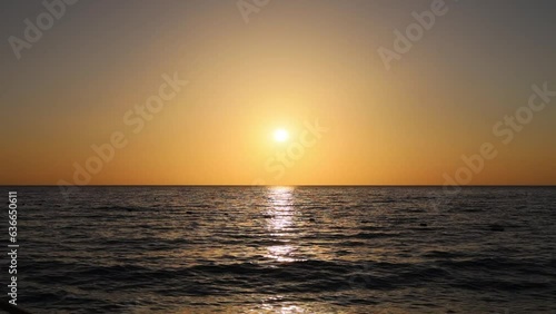 Mediterranean sea with waves in sunny day with island on background
