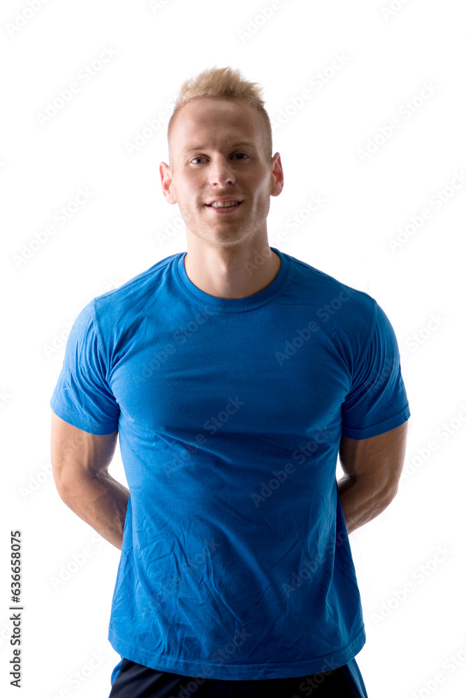 Photo of a handsome man in a blue shirt posing for a picture in a studio Photo of a handsome man in a blue shirt posing for a picture in a studio