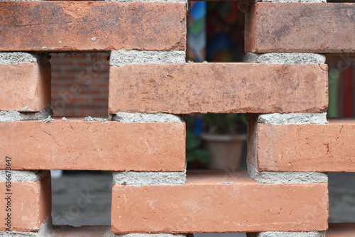 brick walls arranged at a distance so as to cause holes in the wall, a unique wall photo