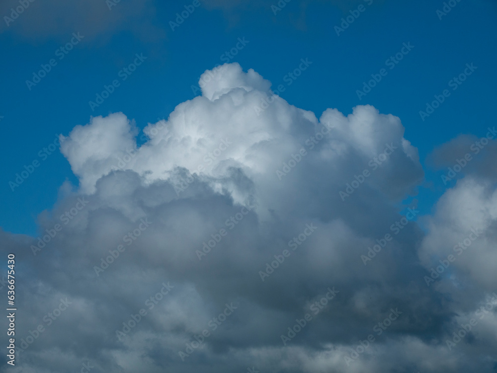 White fluffy clouds in the stormy sky background White fluffy clouds in the stormy sky background