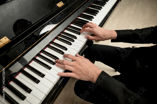 Pianist musician hands playing classical piano music instrument learning practicing jazz harmony melody chord on orchestra theatrical concert stage performance elegance gesture expression talent hobby