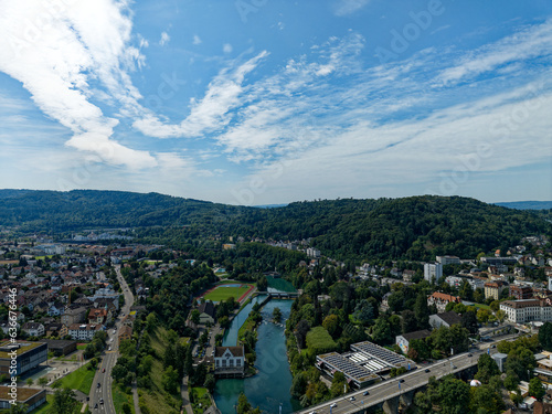 Aerial view of Swiss City of Baden and Swiss City of Wettingen with Limmat River and bridge on a sunny summer noon. Photo taken August 19th, 2023, Baden, Canton Aargau, Switzerland.