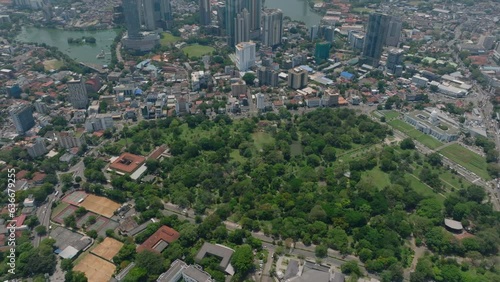 High angle view of public park surrounded by urban boroughs in city. Viharamahadevi Park near City hall. Colombo, Sri Lanka photo