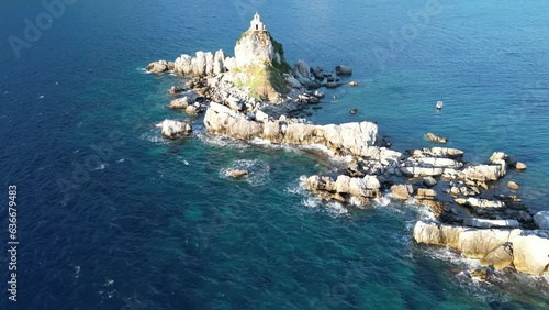 Church on the rock on Katic islet in Petrovac na Moru Aerial View. Beaches and coastline of the Adriatic Sea at summer time. Natural landscapes of Montenegro. Balkans. Europe. photo