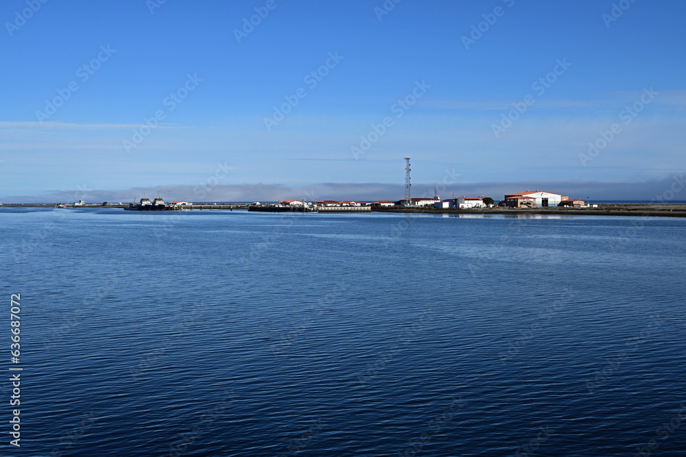 Coast Guard Station on Ediz Hook in Port Angeles Harbor, Washington on clear sunny summer morning. Coast Guard Station on Ediz Hook in Port Angeles Harbor, Washington on clear sunny summer morning.