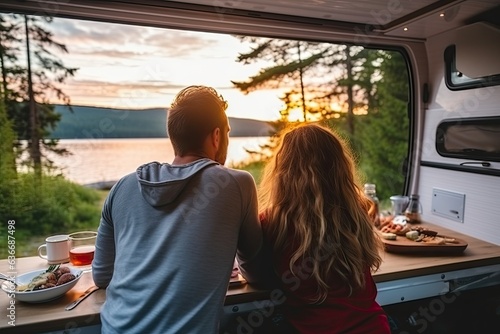 couple having breakfast in camper