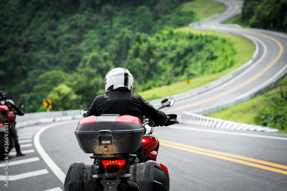 motorcycle on the road rides away. Travel on vacation, enjoy the nature trail. motorcycle in a sunny motorbike on the road riding.with sunset light. copyspace for your individual text. motorcycle on the road rides away. Travel on vacation, enjoy the nature trail. motorcycle in a sunny motorbike on the road riding.with sunset light. copyspace for your individual text.